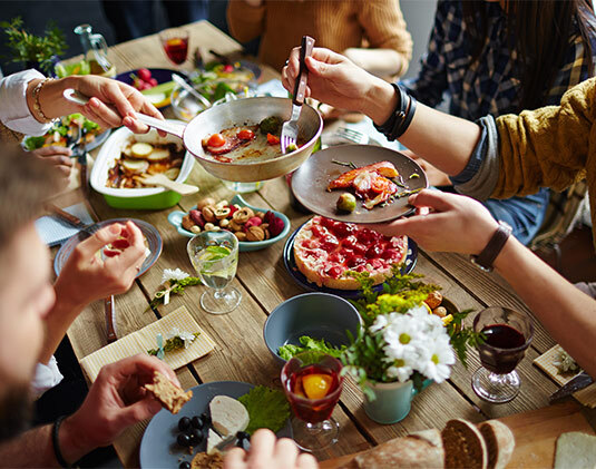 Brad Hefflick and Nydia Hefflick, owners of Dashing Dishes stand with
their three kids